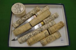 Two Japanese bone handled tantos together with other bone segmented items.