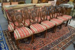 A good set of twelve Chippendale style shield back mahogany dining chairs.