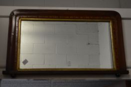 A small Victorian walnut over mantel mirror.,