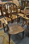A beech and elm wheelback armchair.