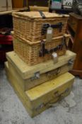 Wicker hampers and vellum suitcases.