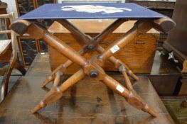 An oak framed folding stool or stand.