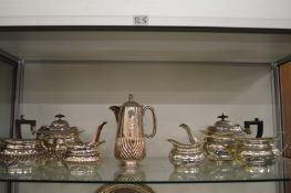 Two plated three piece tea services and a plated hot water jug.