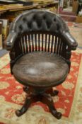 A good late Victorian mahogany and leather upholstered swivel armchair.