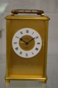 A brass carriage clock.
