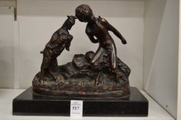 A good bronze group of a young fawn and goat.