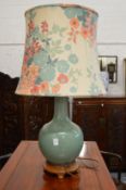 A Chinese green crackle glaze bottle vase shaped lamp on hardwood base.