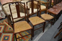 A pair of mahogany occasional chairs and a similar chair.