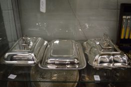 Three plated entree dishes with covers together with a cased set of twelve fish knives and forks.