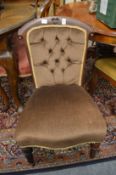 A button upholstered bedroom chair.