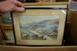 A box of various paintings.