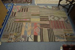 An unusual patchwork style African rug 190cm x 140cm.