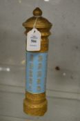 A Chinese porcelain cylindrical vase and cover, blue ground with gilt decoration.