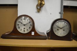 Two mantel clocks.