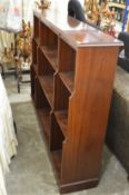 A mahogany open bookcase.