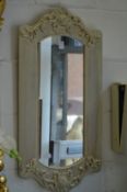 A small decorative wall mirror.