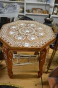 A bone inlaid octagonal shaped occasional table.