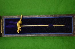 A 9ct gold stick pin.