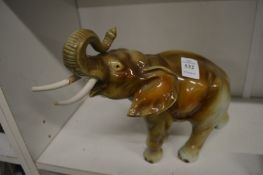Porcelain model of a bull elephant.