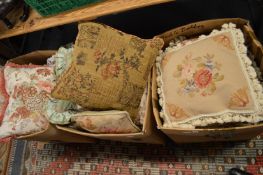 Three boxes of cushions.