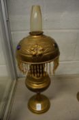 Decorative brass oil lamps.