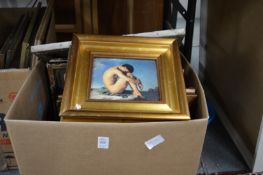 A box of paintings and prints.
