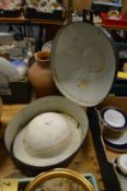 A Pith helmet in black Japanned tin hat box.