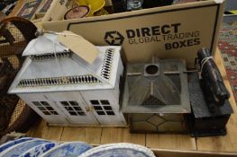 An old box iron, a lantern and other items.