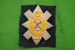 A silver and gilt Black Watch badge 'Nemo Me Impure Lacessit'.