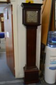 An 18th century small mahogany longcase clock with eight day movement, the square brass dial