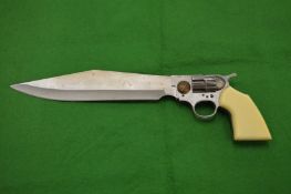 An unusual bowie type knife, the handle modelled as a revolver.