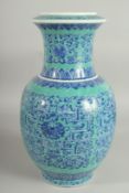 A LARGE CHINESE TURQUOISE GROND BLUE AND WHITE PORCELAIN VASE, with floral motif decoration, base
