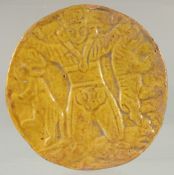AN ISLAMIC GLAZED POTTERY CIRCULAR PLAQUE, 10cm diameter.