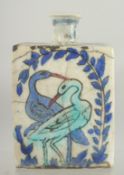 AN IZNIK GLAZED POTTERY BOTTLE, 15cm high.
