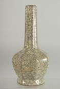 A CHINESE CRACKLE GLAZE BOTTLE VASE, 24cm high.