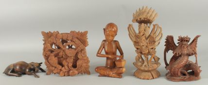 FIVE WOODEN CARVINGS.