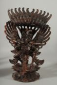 A FINE BALINESE CARVED WOOD FIGURE OF GARUDA, 34.5cm high.