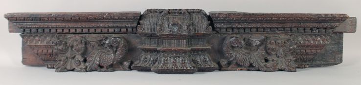 A FINELY CARVED 18TH-19TH CENTURY INDIAN WOODEN DOOR PANEL, 111cm x 20cm.