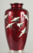 A JAPANESE ANDO GINBARI CLOISONNE VASE, decorated with cranes, Ando mark to rim, 25cm high.
