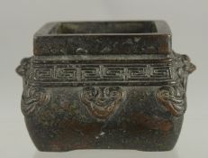 A SMALL CHINESE BRONZE SQUARE-FORM CENSER, 10.5cm at widest point.