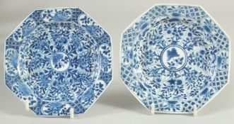 A SMALL PAIR OF CHINESE KANGXI BLUE AND WHITE PORCELAIN OCTAGONAL DISHES, painted with panels of