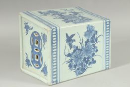 AN UNUSUAL LARGE CHINESE BLUE AND WHITE PORCELAIN PILLOW, painted with panels of flora and fauna,