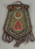 AN OTTOMAN SILVER AND SILK EMBROIDERED BAG WITH TUGHRA.