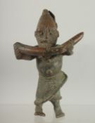 A RARE 19TH CENTURY OR EARLIER AFRICAN BENIN BRONZE FIGURE of a man holding a tusk, 17cm high.
