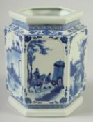A CHINESE BLUE AND WHITE PORCELAIN HEXAGONAL BRUSH POT, decorated with panels of scenes with figures