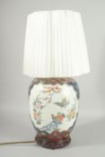 AN IMARI STYLE PORCELAIN LAMP, mounted to a hardwood stand, shade included.