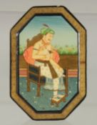 AN INDIAN LACQUERED BOX, the lid with a painting of a seated figure, 11cm x 7.5cm.