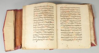 AN ISLAMIC NORTH AFRICAN LEATHER-BOUND MANUSCRIPT, 24.5cm x 19cm.