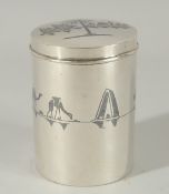 A FINE IRAQI NIELLO INLAID SILVER LIDDED CYLINDRICAL BOX; possibly a tea caddy, 9cm high.