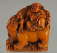 A CHINESE FIGURAL SEAL OF LOHAN, 9.5cm high.